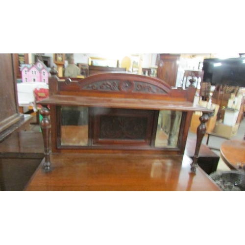 2371 - A mahogany cabinet with bevelled glass lettered door 'Cage Bros. Chicago'.