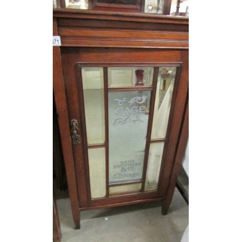 2371 - A mahogany cabinet with bevelled glass lettered door 'Cage Bros. Chicago'.