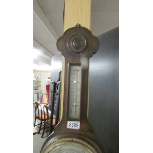 2389 - An oak barometer/thermometer.