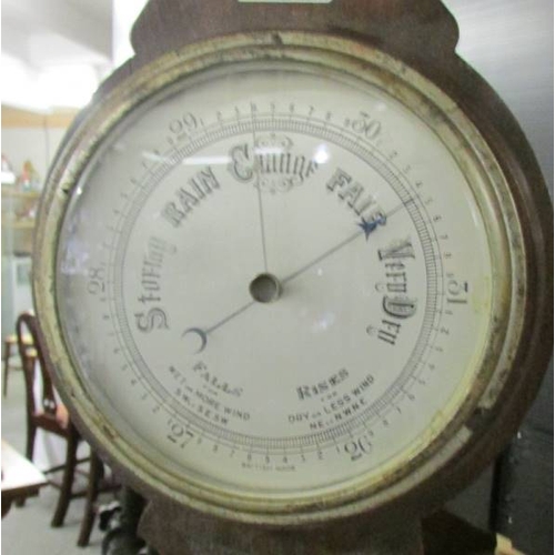 2389 - An oak barometer/thermometer.