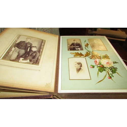 2394 - A Victorian photograph album with photographs.