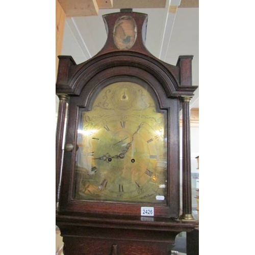 2426 - A good Victorian brass faced Grandfather clock marked Bennett, complete with weights and pendulum.