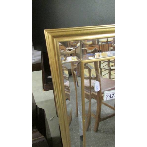 2427 - A good quality gilt framed double bevel edged mirror.