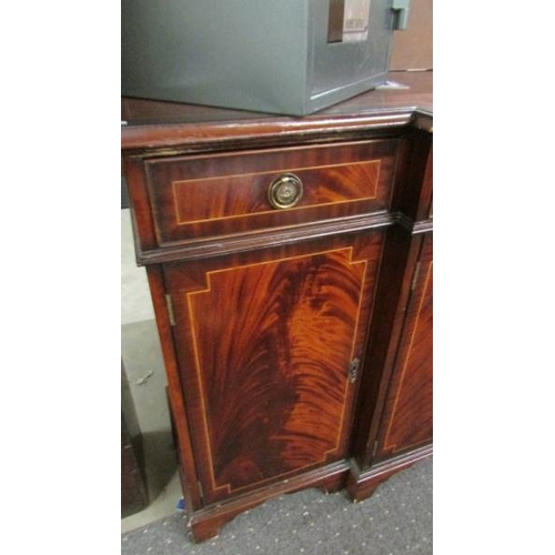 2431 - A mahogany string inlaid break front sideboard in clean condition.