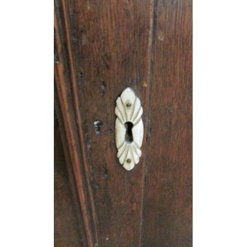 2435 - An early 19th century primitive oak dresser with bone embellishments.