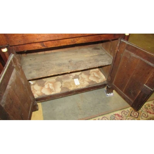 2435 - An early 19th century primitive oak dresser with bone embellishments.