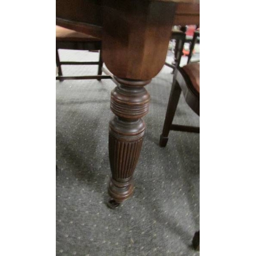 2436 - A mahogany extending wind out table with one leaf and a set of 6 chairs.