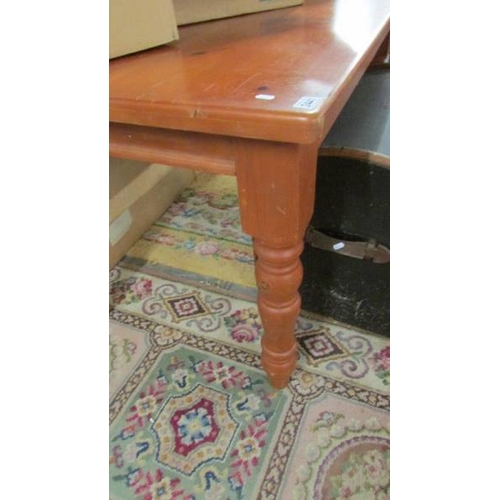 2441 - A mid 20th century pine scrub top kitchen table, 81 x 140 cm.