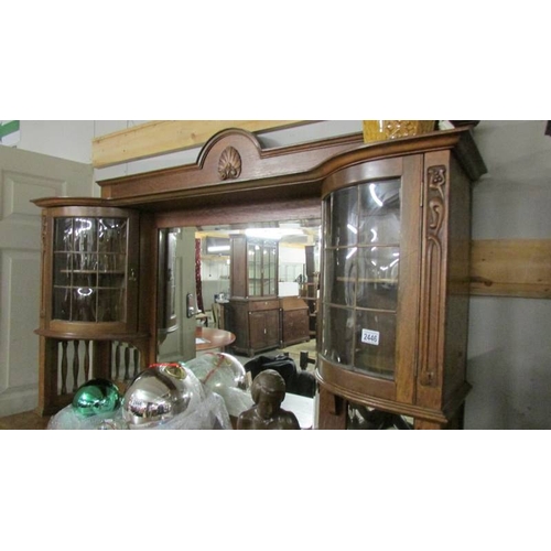 2446 - A good quality oak mirror backed sideboard with top side cabinets.