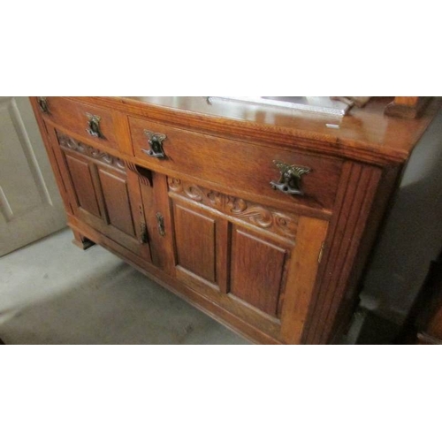 2446 - A good quality oak mirror backed sideboard with top side cabinets.