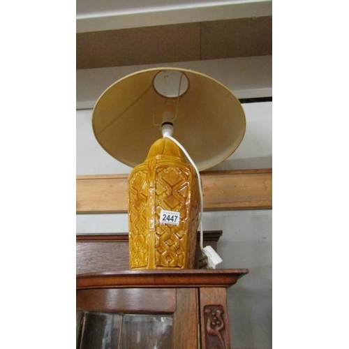 2447 - A ceramic table lamp and a large lamp shade.