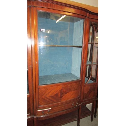 2448 - A good quality Edwardian mahogany display cabinet with domed middle door and astragal glazed side do... 