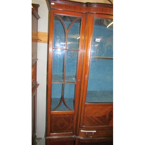 2448 - A good quality Edwardian mahogany display cabinet with domed middle door and astragal glazed side do... 