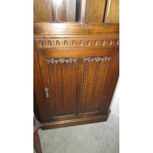 2450 - A good quality oak corner cabinet.