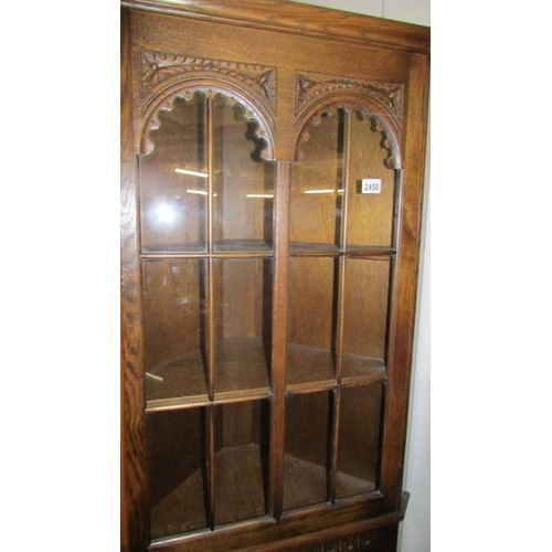 2450 - A good quality oak corner cabinet.