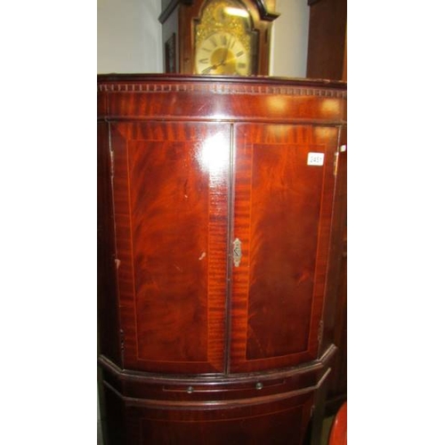 2451 - A mahogany corner cupboard.