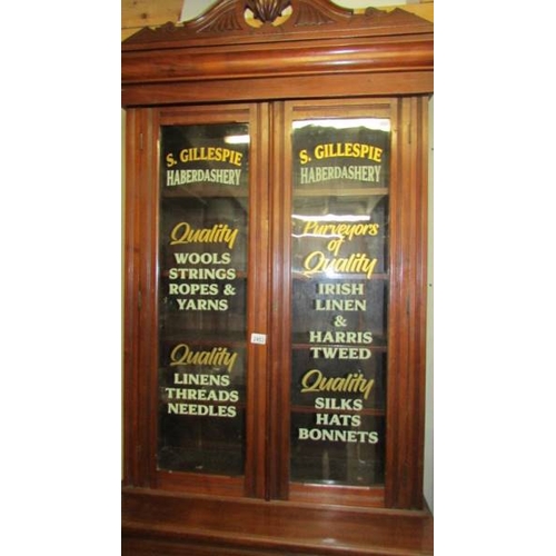 2453 - A sign written haberdashery cabinet.