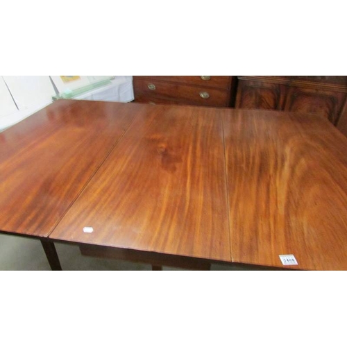 2458 - A Victorian mahogany drop leaf table, in good condition, extended size 703 x 170 cm.