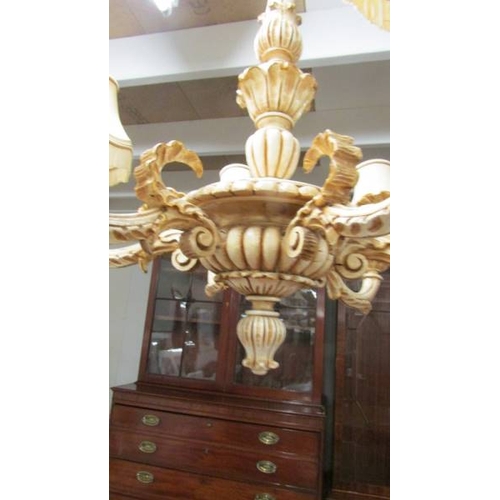 2459 - A large 6 arm wooden chandelier complete with ceiling rose, 71 cm diameter x 80 cm deep.