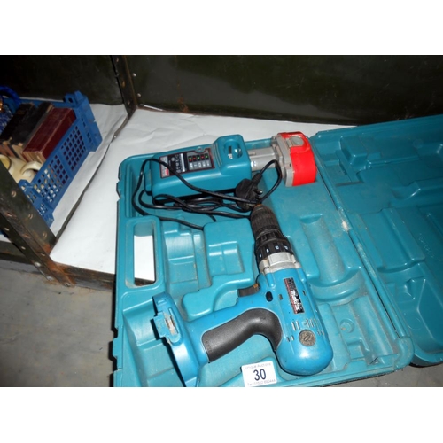 30 - A Cased Makita power drill with charger