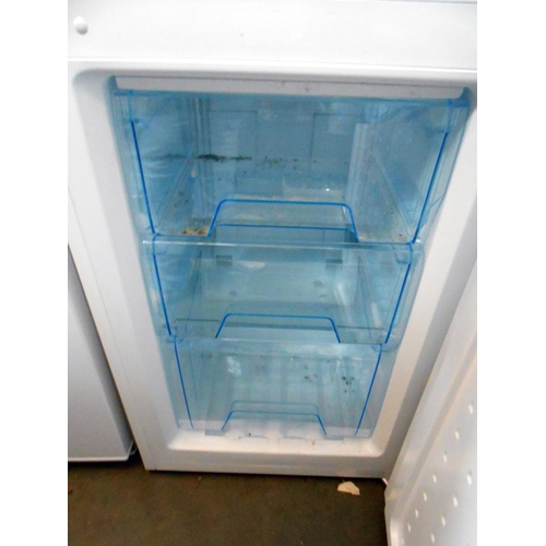 67 - A tall Logik fridge freezer with instructions (model LFC50W12)