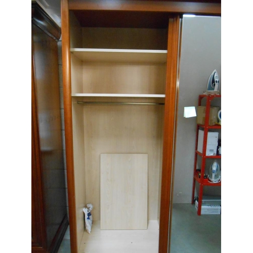 72 - A large teak effect wardrobe with 2 mirrored doors and adjustable shelves, height 216cm, width 170cm... 