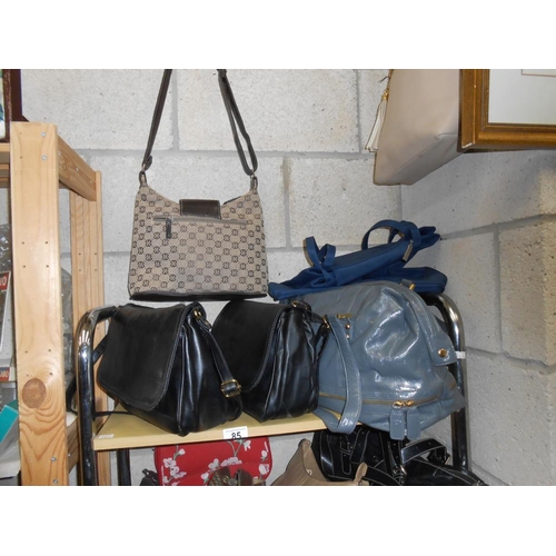 85 - A quantity of ladies handbags etc.