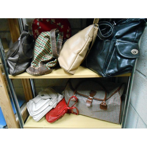 85 - A quantity of ladies handbags etc.