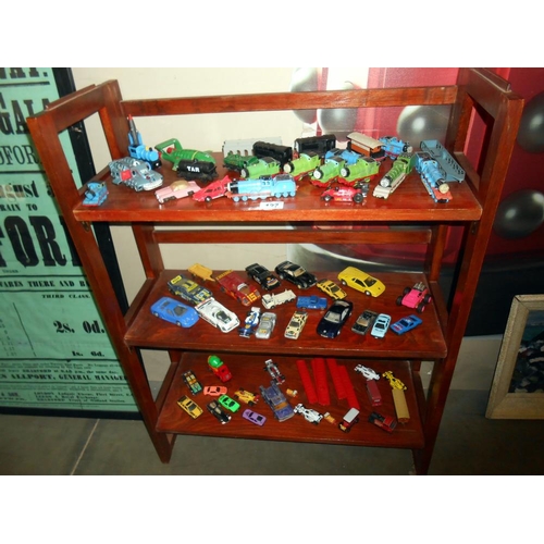 127 - 3 shelves of diecast including Matchbox, Ertl Thomas the Tank Engine etc.