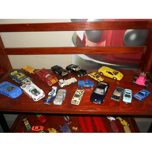 127 - 3 shelves of diecast including Matchbox, Ertl Thomas the Tank Engine etc.