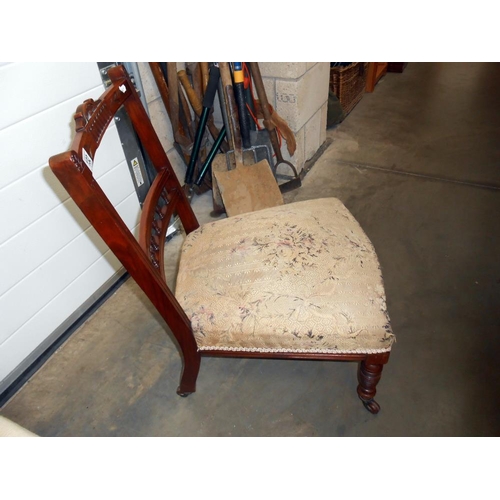 132 - A Victorian nursing chair on casters