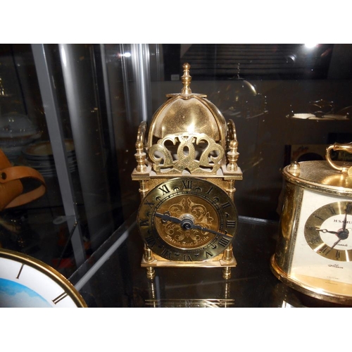 1139 - Two small mantel clocks depicting windmills, a battery lantern clock and a battery carriage clock.