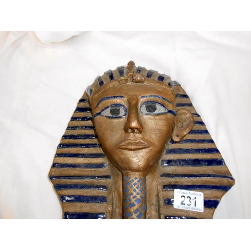 231 - A clay model of Tutankhamun death mask, a/f