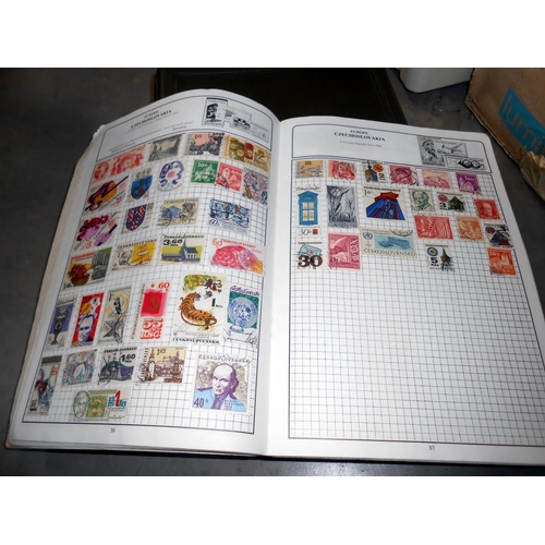 1237 - A box of stamp albums including USA, GB etc.,