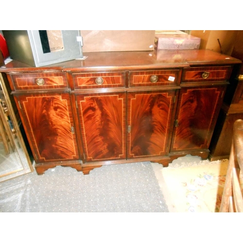 2431 - A mahogany string inlaid break front sideboard in clean condition.