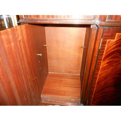 2431 - A mahogany string inlaid break front sideboard in clean condition.