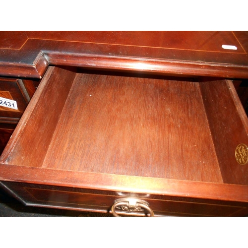 2431 - A mahogany string inlaid break front sideboard in clean condition.