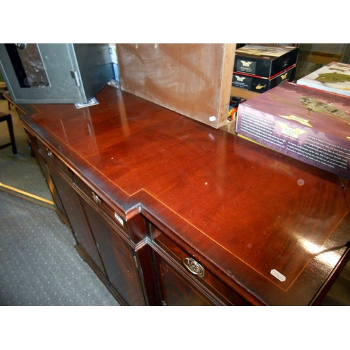 2431 - A mahogany string inlaid break front sideboard in clean condition.