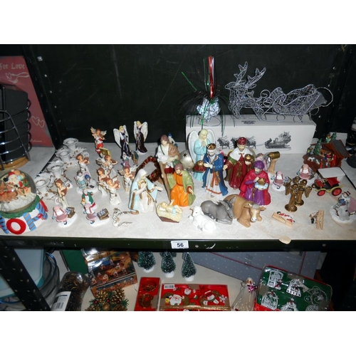 56 - 3 shelves of Christmas decorations including nativity figures and vintage items