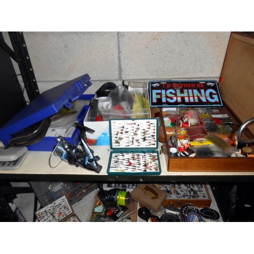 92 - A good lot of fishing gear, includes, 8 fly fishing rods,course fishing rod, reels, spools, flyfishi... 