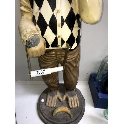 1037 - A painted resin monkey being a fun toilet roll holder, height 80cm