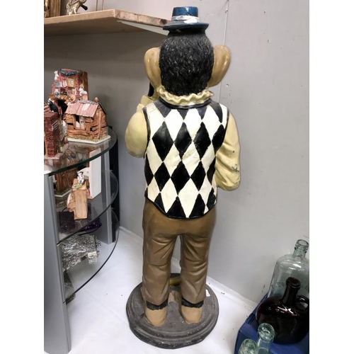 1037 - A painted resin monkey being a fun toilet roll holder, height 80cm