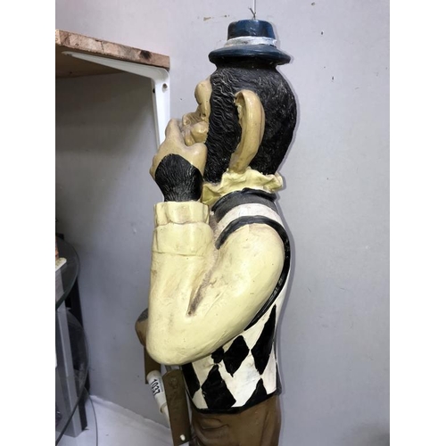 1037 - A painted resin monkey being a fun toilet roll holder, height 80cm