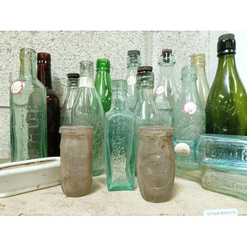 26 - A good lot of Lincoln & name clean bottles including 2 Oxo jars & an Action Man