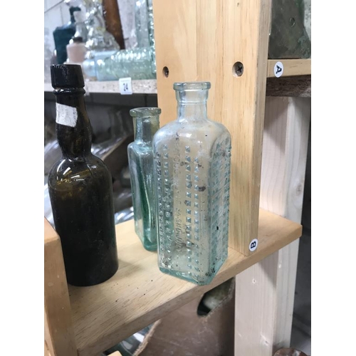 9 - A shelf of potion bottles & a jar of lids