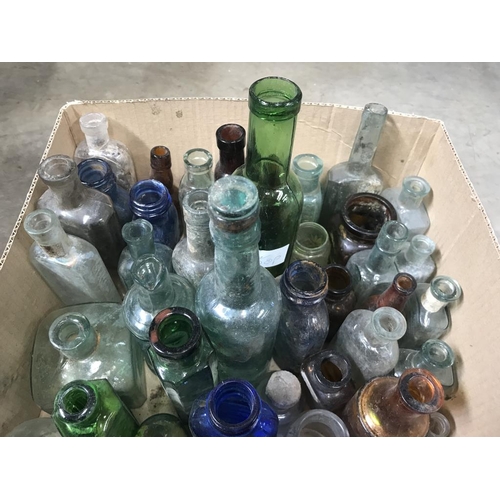 45 - A box of coloured decorative bottles