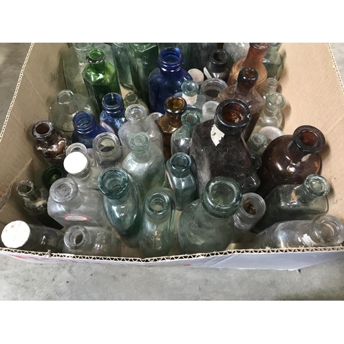 45 - A box of coloured decorative bottles