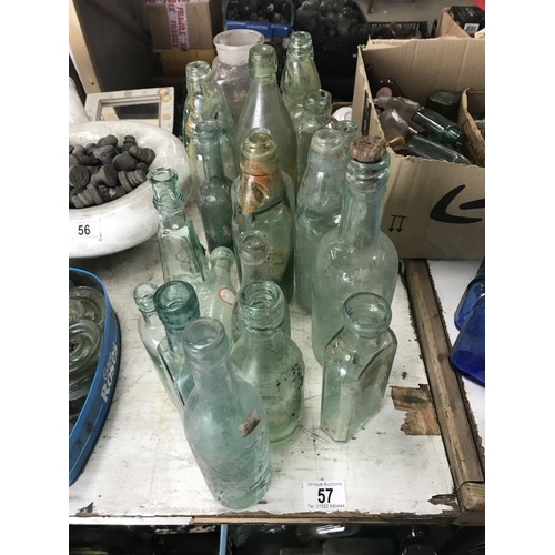 57 - A good lot of clear glass bottles