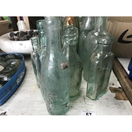 57 - A good lot of clear glass bottles