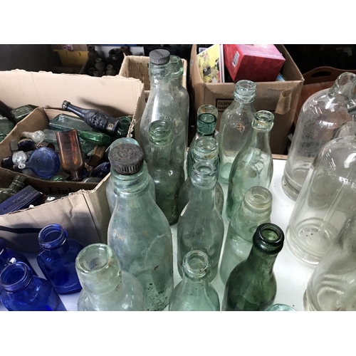 59 - A large lot of clear 'local area' bottles